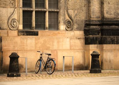 Bicycle in front of bricks