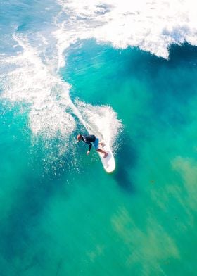 Surfer Catching Wave