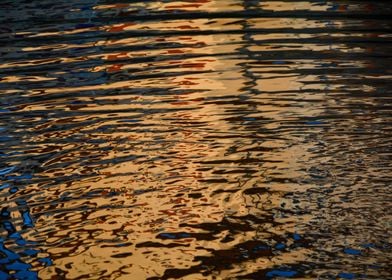 Golden rippled water surfa