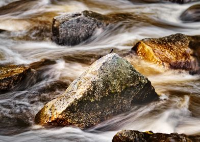 Stones in flowing water