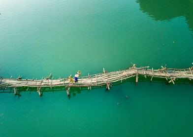 Crossing a bamboo bridge