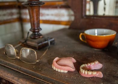 Eyeglasses and denture