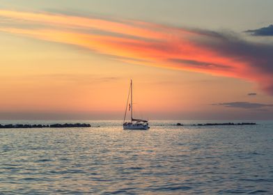 sunset over sailing boat