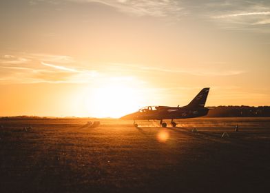 military plane with sunset