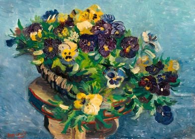 Basket of pansies on table