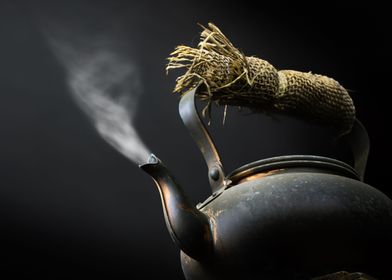 Black kettle with steam