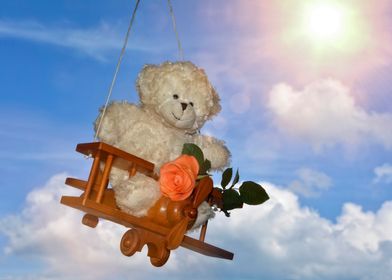 A teddy bear flies towards