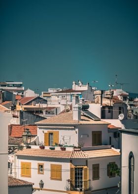 Roofs And Yellow Windows