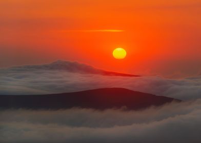 Sunrise over the clouds