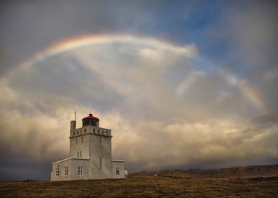 Lighthouse under rainbow