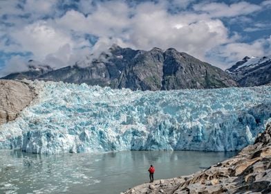 Man standing near glacier