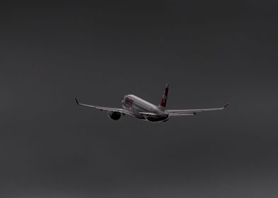 A220 leaving stormy GVA