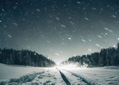 Snowy road at night