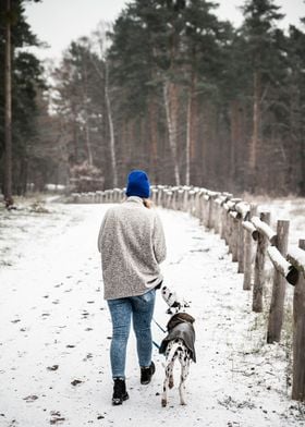 Woman with dog in forest