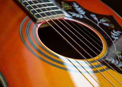 Brown acoustic guitar