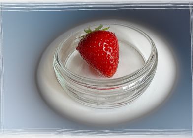A strawberry in a cup