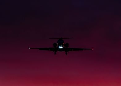Private Jet on sunset sky