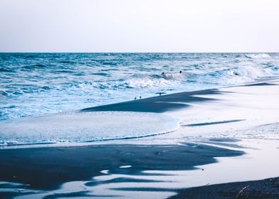 Waves coming in at sunset