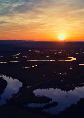 Sunset above river