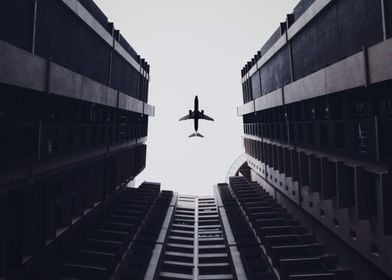 Airplane above buildings