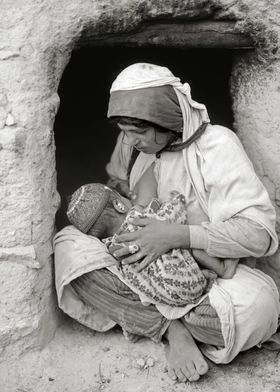 Syrian woman nursing baby 