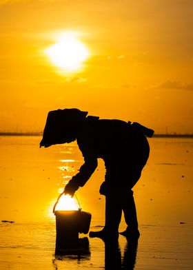 farmer shoveling the sun