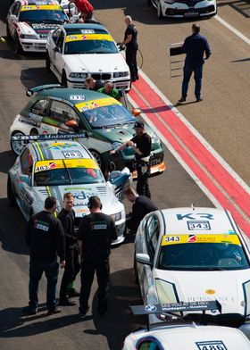 Race cars in the pit lane