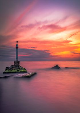 Lighthouse with fiery sky