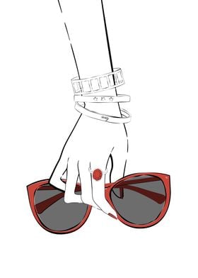 Hand holding sunglasses