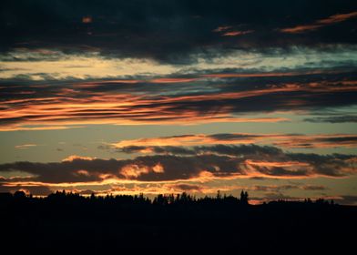 a sunset with clouds 