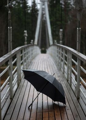  Umbrella on wooden bridge