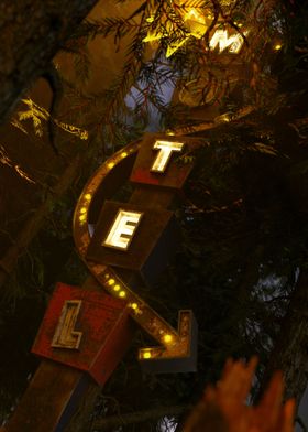 Motel Sign in Dark Forest