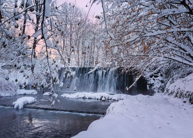 Winter waterfall on river