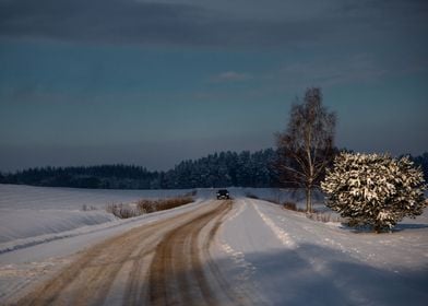 Car on snowy winter road