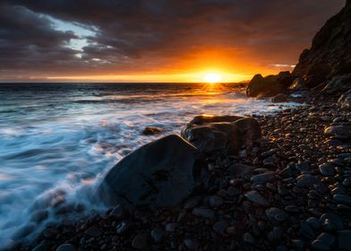 Sunset at a stone beach