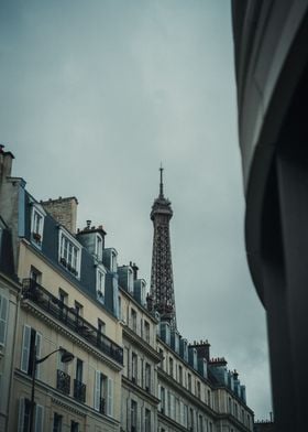 Eiffel Tower behind houses