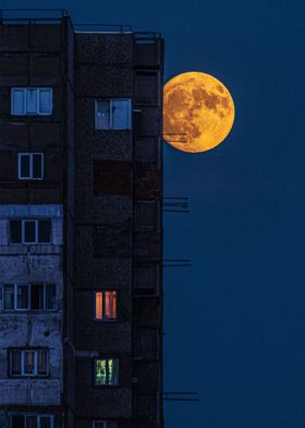 Moon against a building