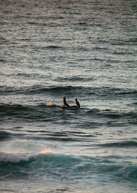 Surfers at Dusk