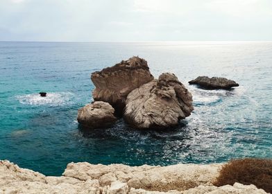 a body of water with rocks