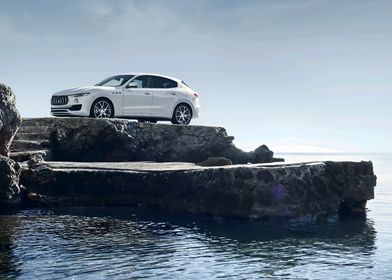 White Maserati Levante SUV on Rocks