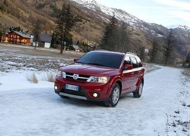 Red Fiat SUV on Snowy Road