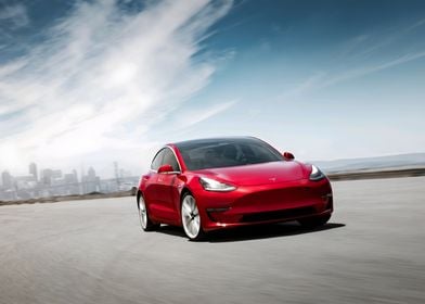 Red Tesla Model 3 Driving