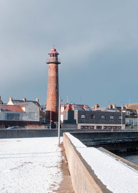 Lighthouse on Snowy Coast