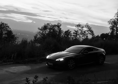 Aston Martin Black Sports Car on Winding Road