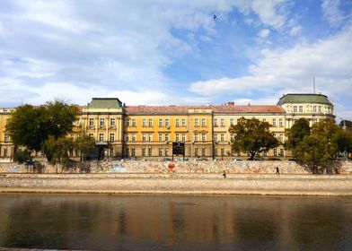 Riverfront Building with Graffiti