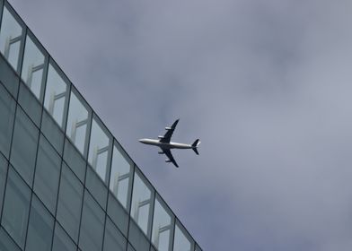 Airplane Flying Over City