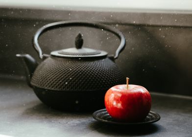 Black Teapot and Red Apple