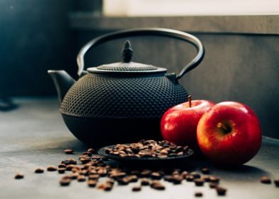 Black Teapot with Apples and Coffee Beans