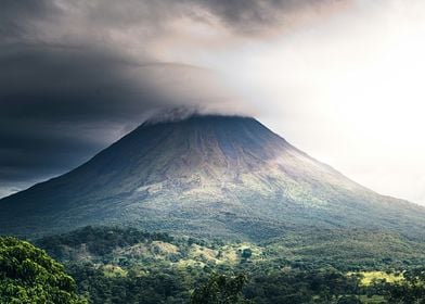 Volcano Under Storm Clouds