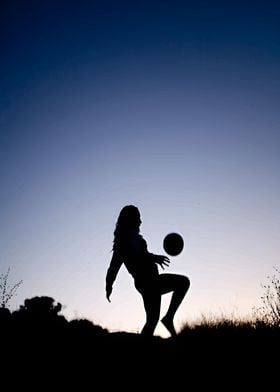 Silhouette of a Girl Playing Soccer